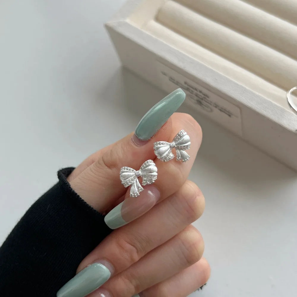 Silver Zircon Round Cut Bow Tie Ear Studs