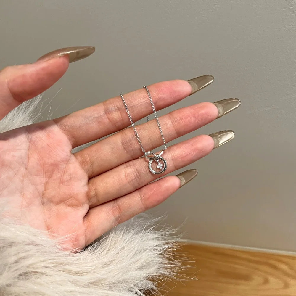 Silver Zircon Princess Cut Twisted Bow Knot Pendant Necklace