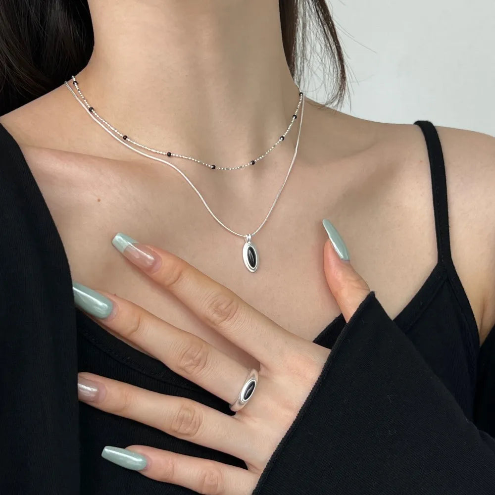 Silver Onyx Oval Cut Herringbone Pendant Necklace