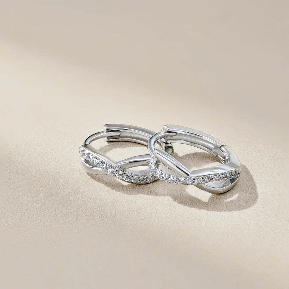 Silver Zircon Round Cut Iced Twisted Huggie Earrings