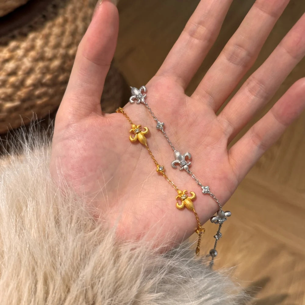 Silver Zircon Round Cut Fleur-De-Lis Charm Bracelet