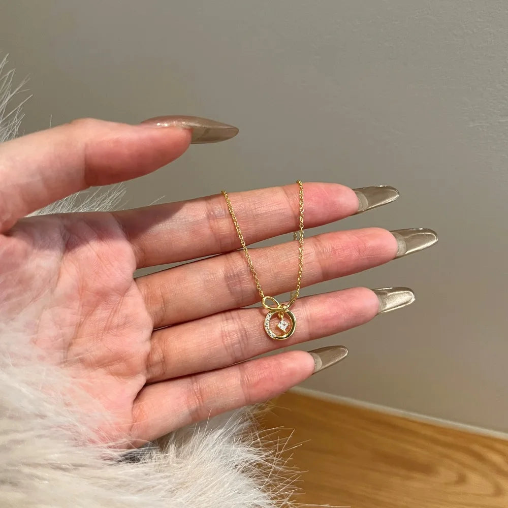 Silver Zircon Princess Cut Twisted Bow Knot Pendant Necklace