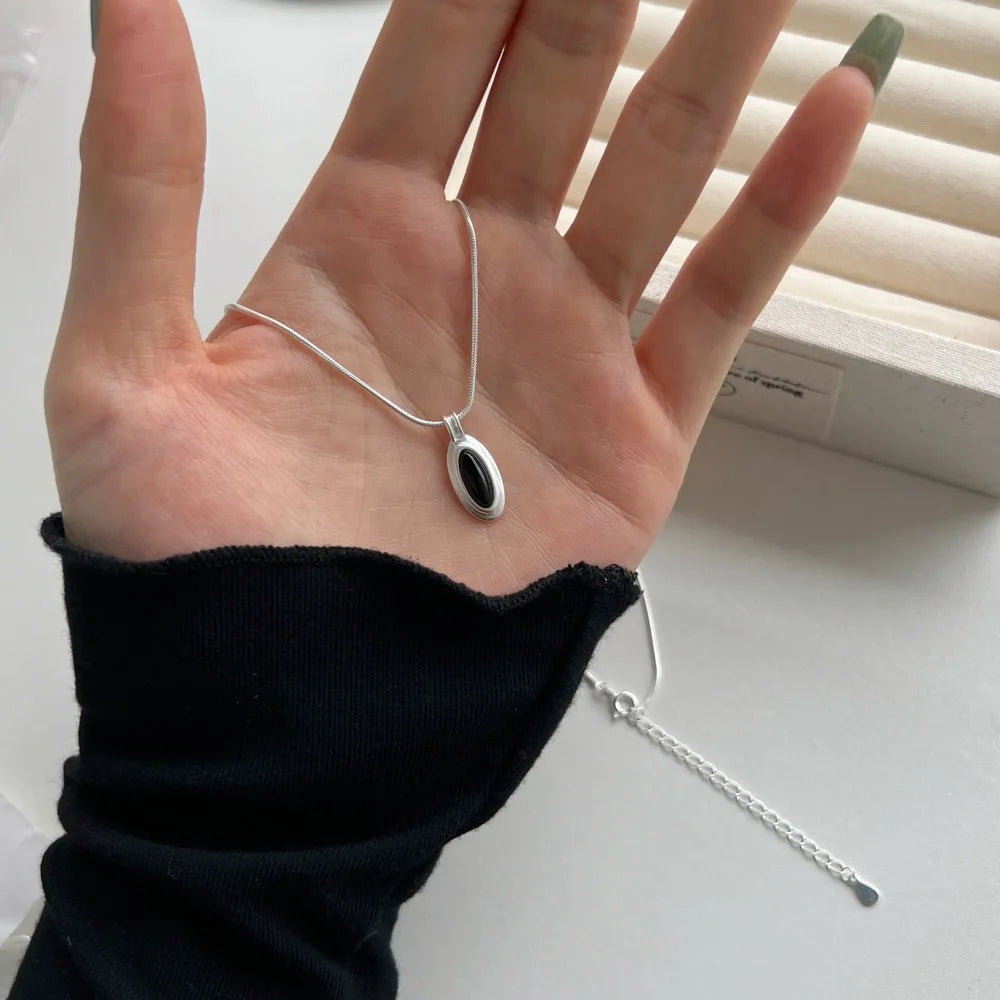 Silver Onyx Oval Cut Herringbone Pendant Necklace