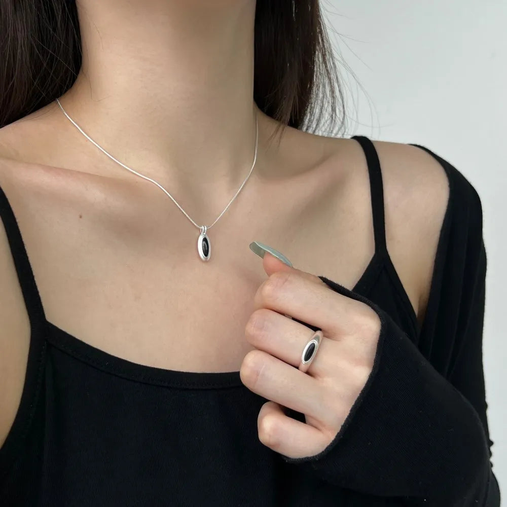 Silver Onyx Oval Cut Herringbone Pendant Necklace