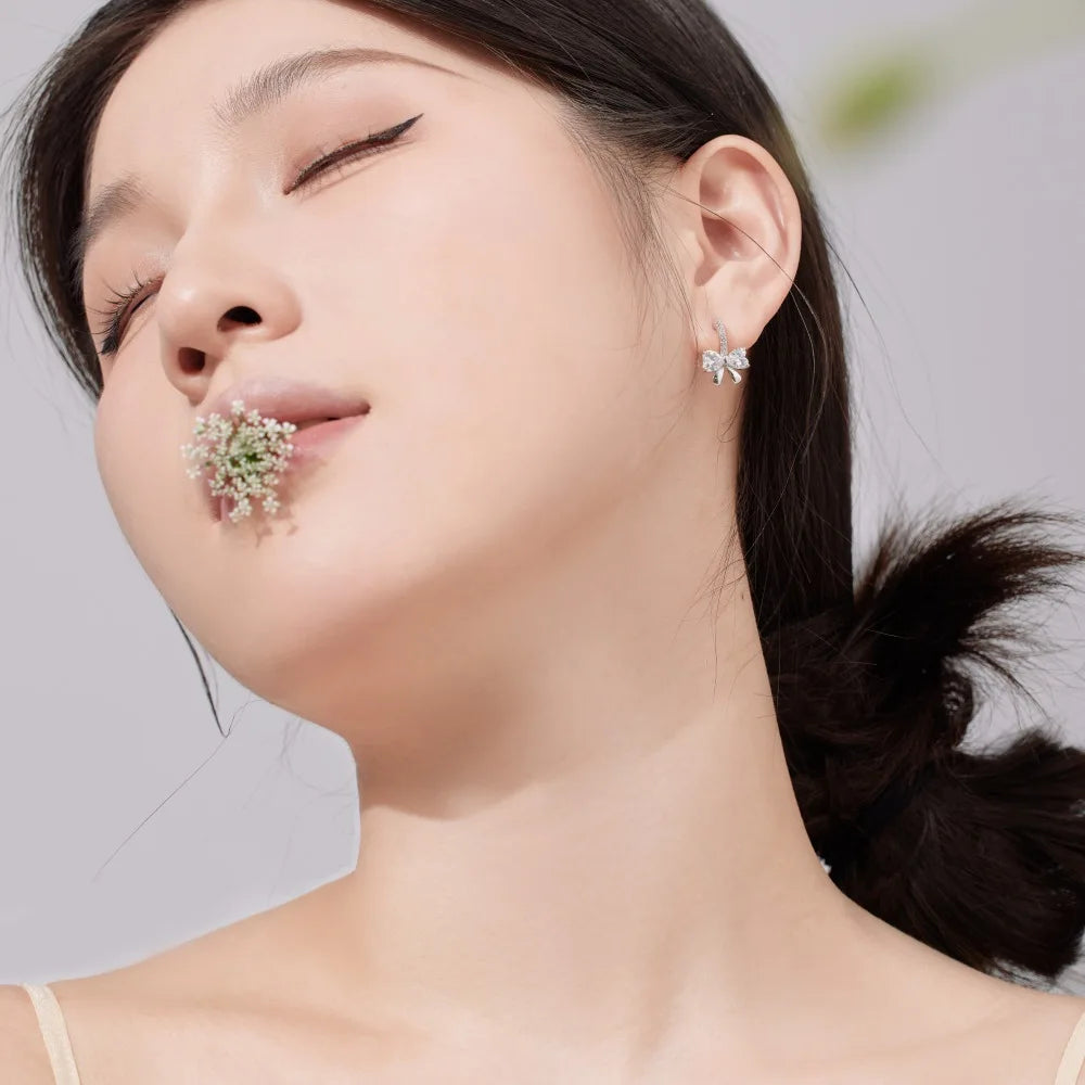 Silver Zircon Heart Cut Bow Huggie Earrings