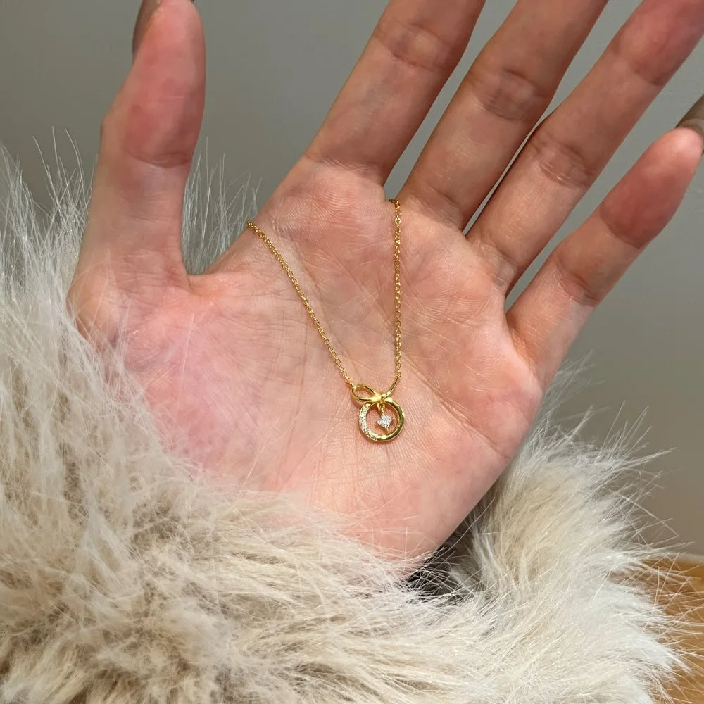 Silver Zircon Princess Cut Twisted Bow Knot Pendant Necklace