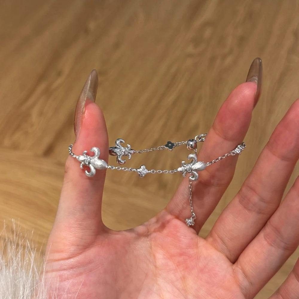 Silver Zircon Round Cut Fleur-De-Lis Charm Bracelet