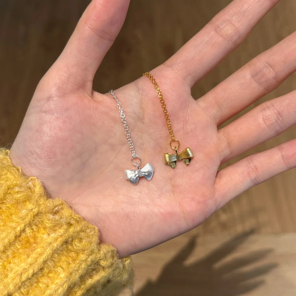 Silver Bow Pendant Necklace