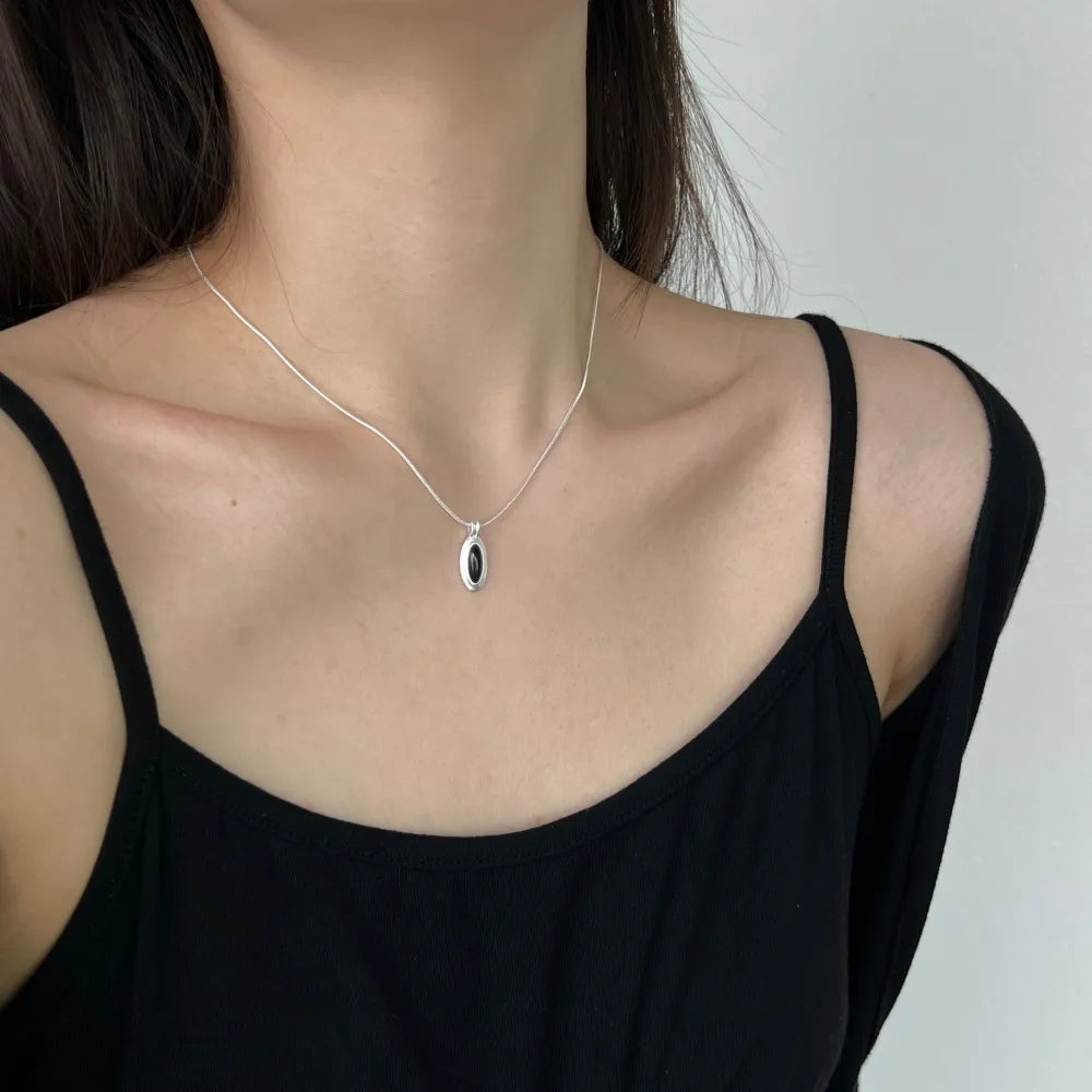 Silver Onyx Oval Cut Herringbone Pendant Necklace