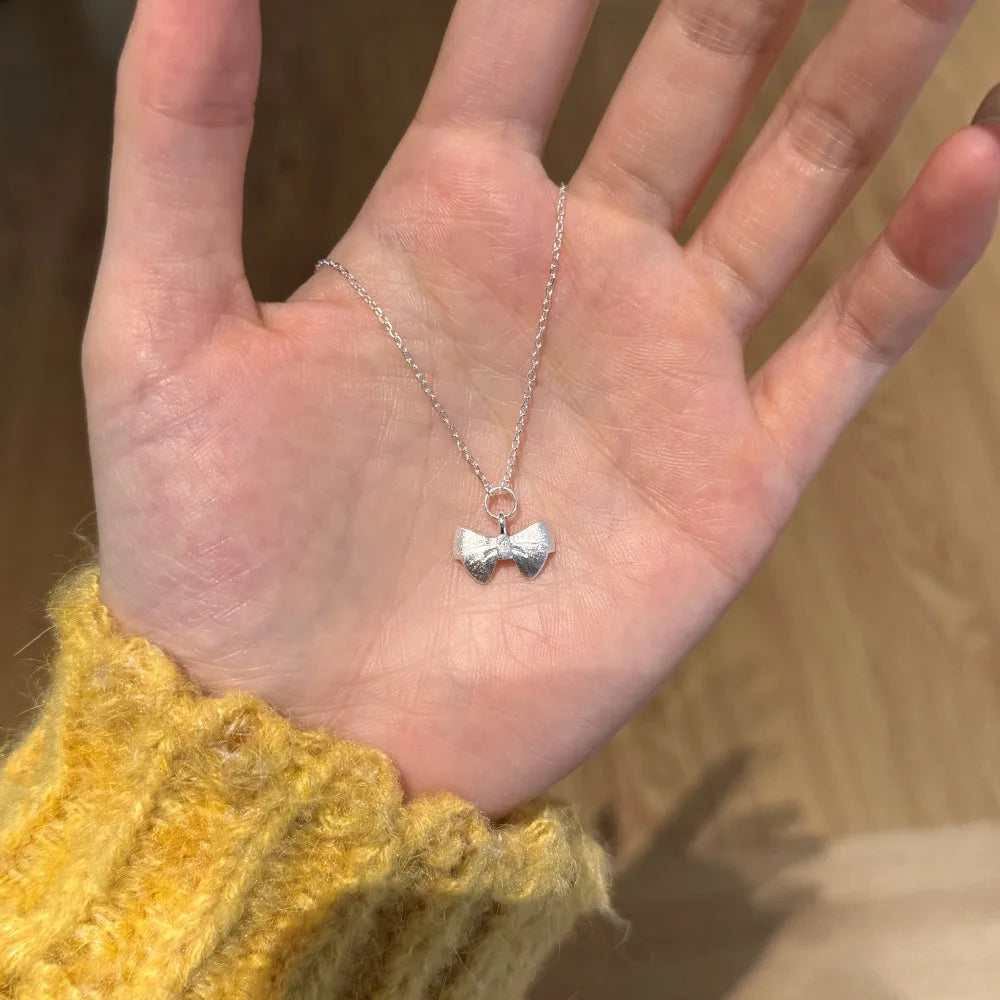 Silver Bow Pendant Necklace