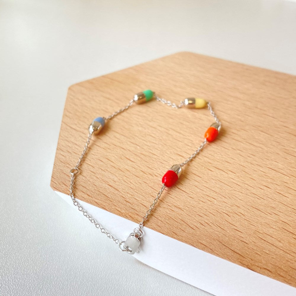 Silver Capsule Charm Bracelet